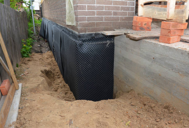 Happy homeowners after waterproofing job in Bowersville